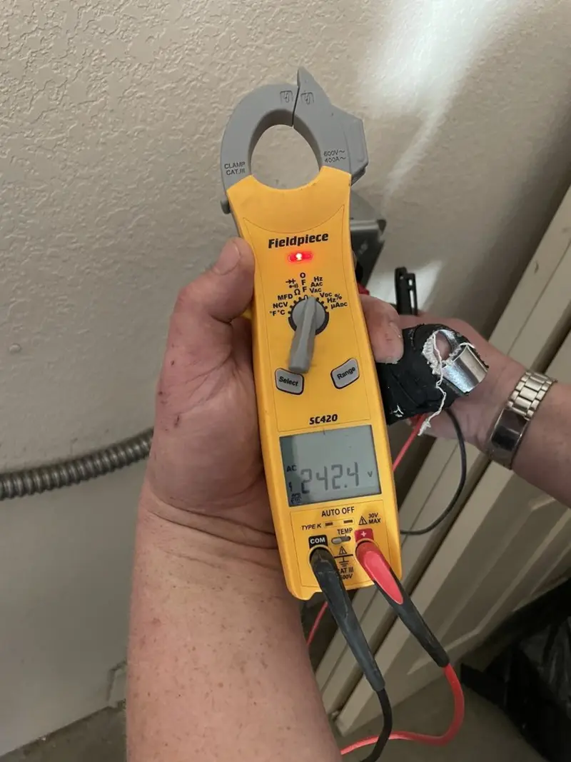 Voltage testing with clamp meter during Electrical Installation Services in South Heidelberg